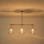 Suspension moderne à 3 lumières en verre doré linéaire avec globe et bulles pour îlot de cuisine