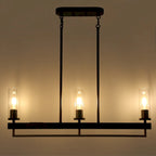 Lustre moderne traditionnel à 3 lumières, noir et or, avec abat-jour en verre transparent, idéal pour îlot de cuisine ou salle à manger.